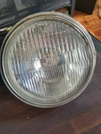1978 Honda Complete Headlight Bucket Assembly #325.3-69. Fixed Price $75.00.