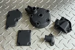 Suzuki RM125 Cylinder Head, Power Valve, And Water Pump Covers. Fixed Price $225.00.